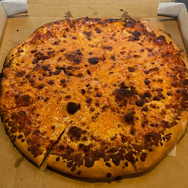 A whole, sliced Bruno's Pizzeria cheese pizza with a golden-brown crust and melted, bubbly cheese.